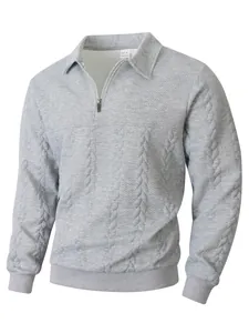 Grey men's polo sweater featuring intricate jacquard knit and half-zip collar detail