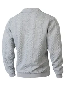 Rear view of grey cable-knit polo shirt showing textured jacquard fabric.