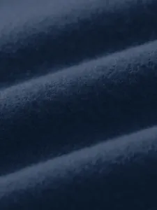 Close-up macro view of soft navy blue fleece fabric texture for autumn/winter sports top