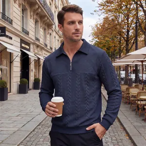 Detailed texture of men's navy blue half-zip jacquard sweater in a street setting