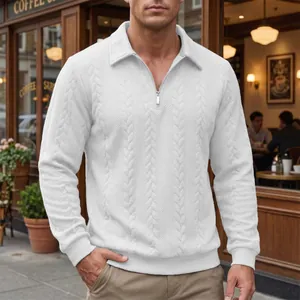 Detail view of men's white long sleeve polo shirt with textured cable knit and half zipper