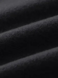 Macro view showing the soft black fleece fabric texture of the men's winter casual sports top
