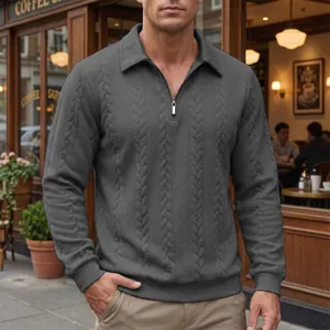 Close-up of men's textured grey polo shirt featuring a half-zip and classic collar