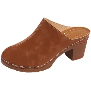 Classic brown chunky heel closed-toe mules with platform sole and white contrast stitching