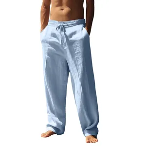 Macro view of men's loose linen trousers featuring a comfortable elastic drawstring waist