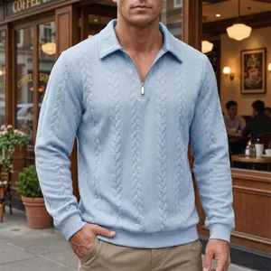 Detail view of men's light blue cable knit polo shirt with half-zip closure