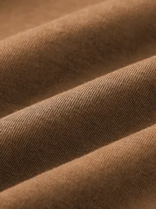 Macro view of brown soft knit fabric showing high-quality texture and weave detail