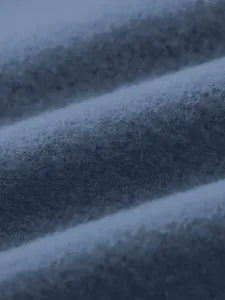 Detailed macro shot of soft brushed navy blue fleece fabric texture for men's casual sports top