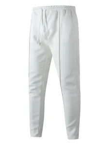 High-definition detail of men's white waffle knit slim sweatpants with drawstring waist