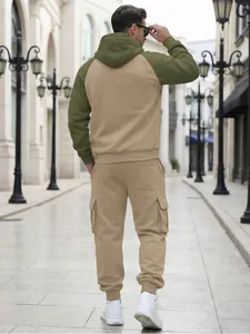 Back view detail showing the raglan sleeves and cargo pockets of a men's tracksuit