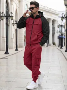 Close-up detail of a red and black color-block hooded jacket and cargo pants tracksuit