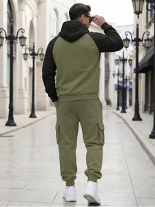 Back view of men's olive green fleece tracksuit set with cargo pockets on street