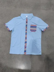Detail of light blue men's casual shirt with bohemian striped pocket and placket.