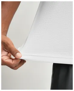Macro view of white breathable mesh fabric detail on a men's quick-dry sports T-shirt