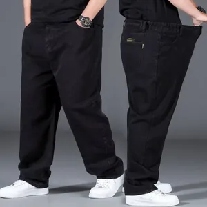 Detailed views of oversized black straight leg jeans for men showing front and side fit