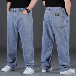 Detail showcase featuring the front and back view of light blue oversize straight leg jeans.