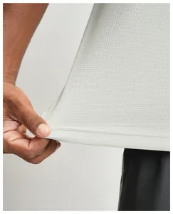 Detailed close-up showing the breathable quick-dry mesh fabric of a men's sports t-shirt