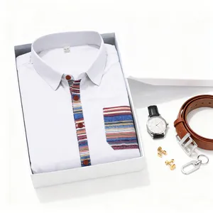 Close-up of white Bohemian style short-sleeved shirt neatly folded in a premium gift box