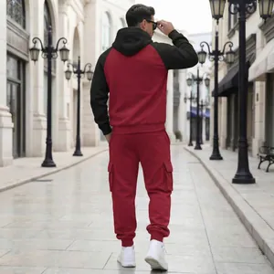 Back view of men's fleece cargo hoodie set in maroon and black.