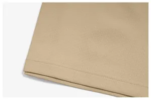 Macro shot of quick-dry breathable fabric and double-stitched hem detail on men's sport t-shirt