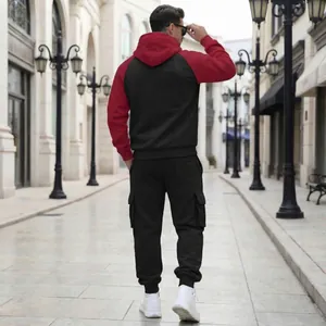 Back view of men's two-piece fleece tracksuit with color-block hoodie and cargo joggers