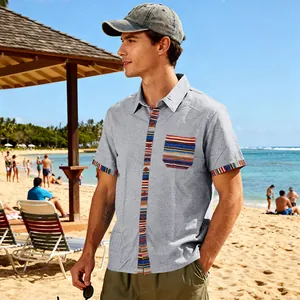 Close-up of men's beach shirt featuring bohemian patterned trim on pocket and sleeve