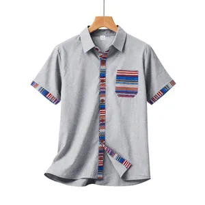 Detailed view of men's gray short sleeve shirt with Bohemian striped pocket and cuffs