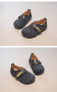 Detailed view of children's grey wool retro Mary Jane shoes with buckled leather straps
