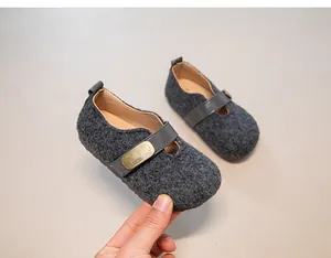 Detailed view of grey wool felt children's Mary Jane shoes with vintage fashion buckle