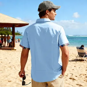 Back view of a light blue men's beach shirt with Bohemian striped cuff details.