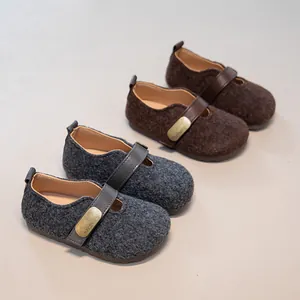 Cozy grey and brown children's felt loafers with warm lining and stylish straps