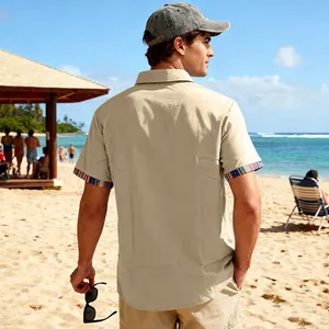 Detail view showing the back fit of a men's beige shirt with bohemian-style cuffs