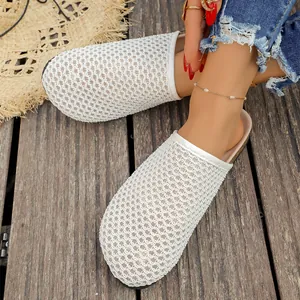 Close-up of white woven mesh mules with closed-toe design for summer vacation