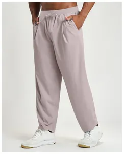Detailed view of men's quick-dry breathable casual sports pants in a soft mauve color.
