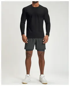 Detail view of men's black quick-dry long sleeve athletic shirt on a fit model