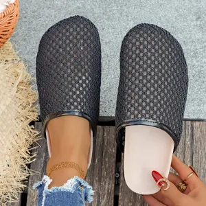 Detailed view of breathable black mesh closed-toe mules for women in summer vacation
