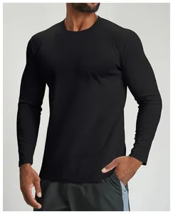 Detailed view of men's black quick-dry long-sleeve sports shirt on fitness model