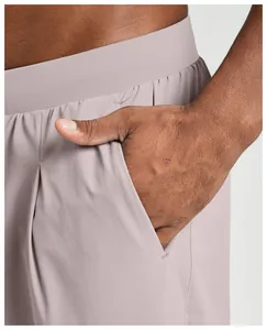 Detail showing side pocket of men's quick-dry sports leisure pants in mauve color