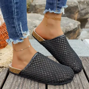 Elegant black woven mesh closed-toe mule sandals for women featuring cork-style soles