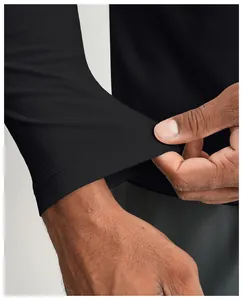 Detail of black quick-dry fabric showing elasticity and stitch quality on the cuff