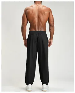 Back view of men's quick-dry black sports pants for outdoor hiking and casual wear