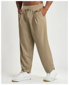 Detailed view of men's breathable khaki quick-dry sports pants with drawstring waist.