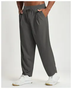Detail view of gray quick-drying men's casual hiking pants with elastic drawstring waist