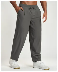 Detail view showing the relaxed fit and texture of men's quick-dry athletic pants.