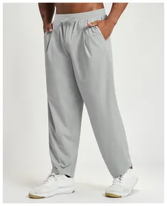 Detail view of men's grey quick-dry breathable casual hiking pants with elastic waist