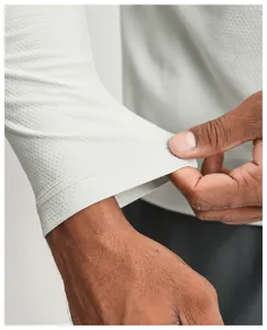 Detail shot of quick-dry sports long sleeve shirt cuff showing breathable mesh fabric