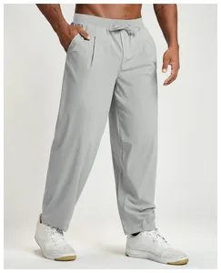 Detail of men's light gray quick-dry athletic pants for hiking and casual wear