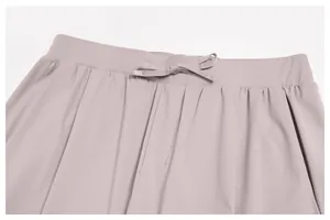Close-up detail showing the elastic waistband and flat drawstring on quick-dry sports trousers
