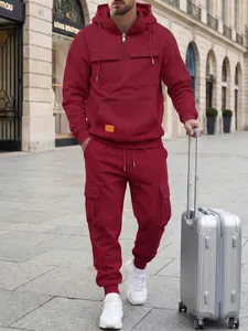 Premium men's burgundy hoodie and cargo pants tracksuit set in urban street setting
