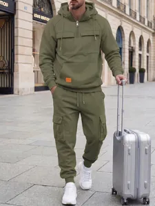 Detailed outdoor view of men's olive green hooded cargo sweatshirt and pants set.